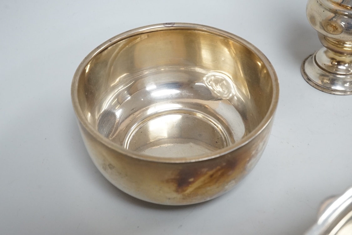 Two George V silver sauceboats, one by Asprey & Co, a silver pepperette, a silver bowl and a modern silver sugar caster, 16oz.